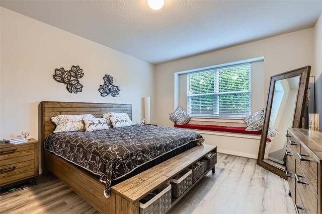 17301 Leafroller Dr Unit A, Pflugerville, TX 78660 - bedroom featuring wood finished floors and baseboards