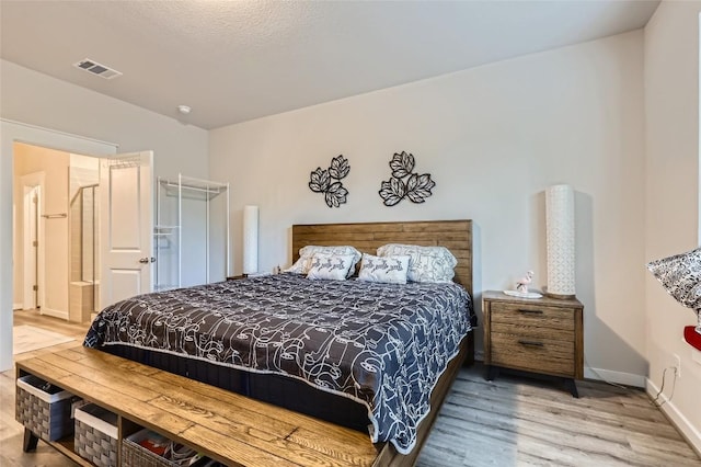 17301 Leafroller Dr Unit A, Pflugerville, TX 78660 - bedroom with wood finished floors and baseboards