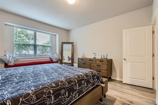 17301 Leafroller Dr Unit A, Pflugerville, TX 78660 - bedroom with wood finished floors and baseboards