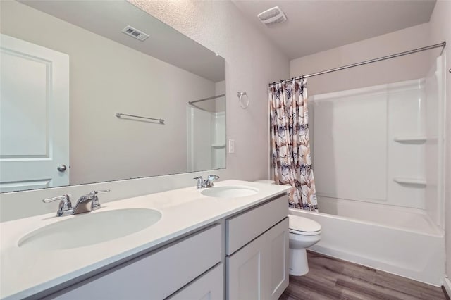17301 Leafroller Dr Unit A, Pflugerville, TX 78660 - full bath featuring wood finished floors, toilet, shower / bath combo, and double vanity
