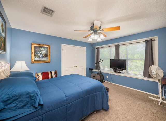 1810 Summer Rain Dr, Cedar Park, TX 78613 - carpeted bedroom featuring a textured ceiling, a closet, a ceiling fan, and baseboards