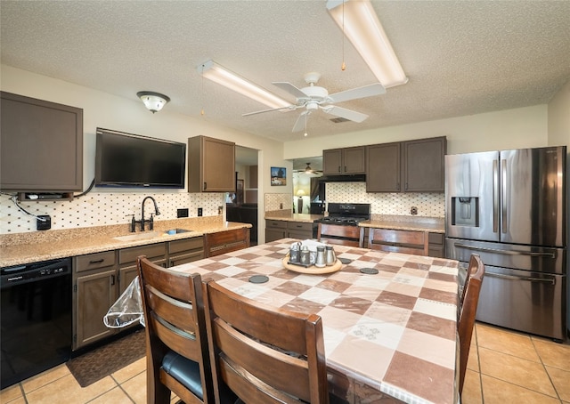 1810 Summer Rain Dr, Cedar Park, TX 78613 - kitchen with stainless steel fridge, black dishwasher, a sink, range with gas cooktop, and ceiling fan