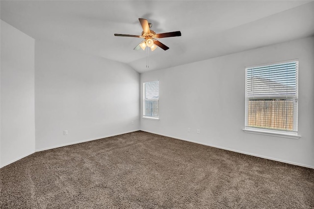 empty room with carpet flooring, ceiling fan, and baseboards