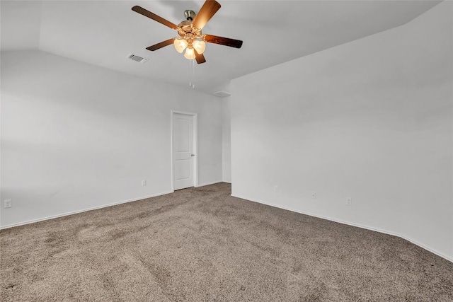 empty room with carpet flooring, a ceiling fan, baseboards, and lofted ceiling