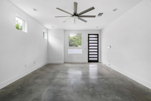 1314 Delano St Unit A, Austin, TX 78721 - spare room with concrete floors, a ceiling fan, and baseboards
