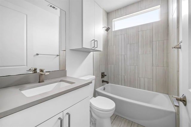 1314 Delano St Unit A, Austin, TX 78721 - bathroom featuring toilet, vanity, and shower / tub combination