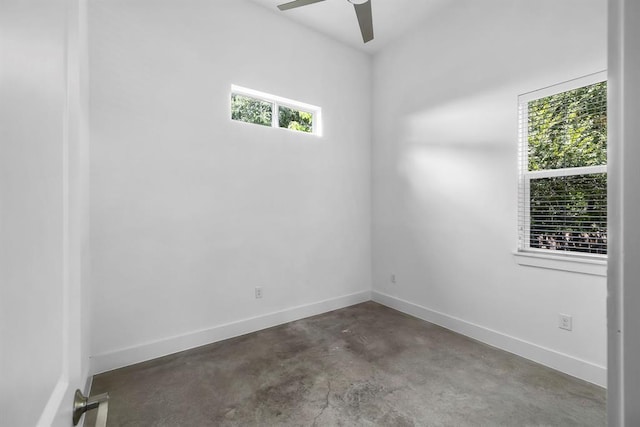 1314 Delano St Unit A, Austin, TX 78721 - unfurnished room with concrete floors, a ceiling fan, and baseboards