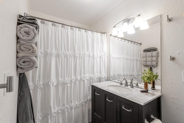 326 Zapalac Rd, Smithville, TX 78957 - full bathroom featuring a textured wall, vanity, and a shower with curtain
