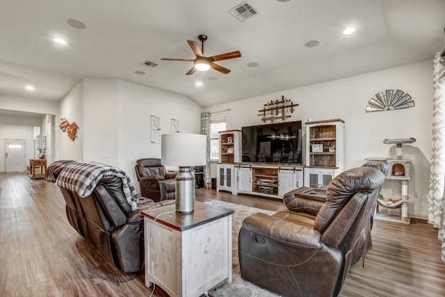 living area featuring wood finished floors, a ceiling fan, recessed lighting, and baseboards
