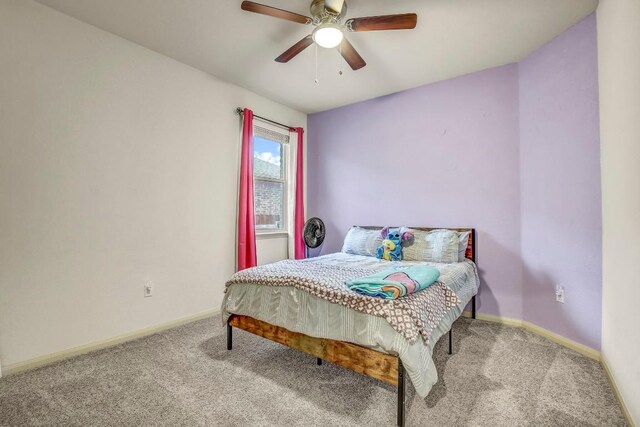 bedroom featuring carpet floors, baseboards, and ceiling fan
