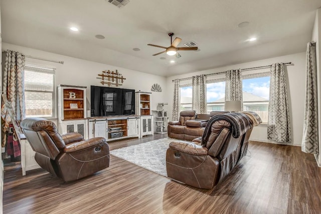 living area featuring a ceiling fan, wood finished floors, plenty of natural light, and recessed lighting