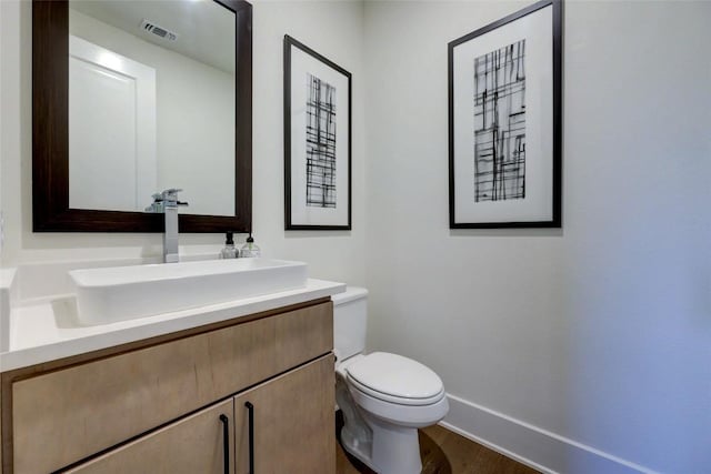 105 Isaac White Dr, Bastrop, TX 78602 - half bath featuring vanity, toilet, and baseboards