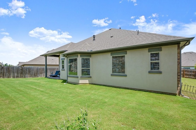 147 Epoch Dr, Austin, TX 78737 - rear view of property featuring a shingled roof and stucco siding