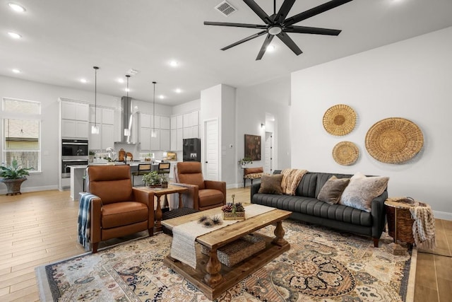 147 Epoch Dr, Austin, TX 78737 - living room with light wood-style flooring, ceiling fan, and recessed lighting