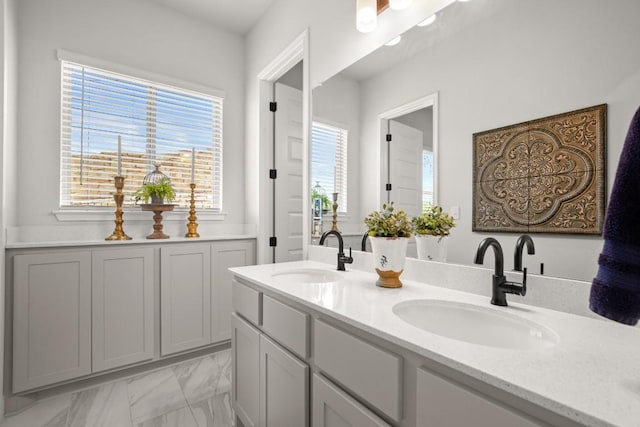147 Epoch Dr, Austin, TX 78737 - full bathroom with double vanity and marble look tile flooring