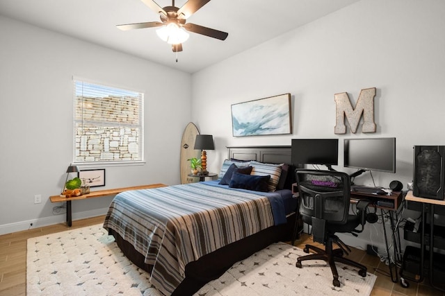147 Epoch Dr, Austin, TX 78737 - bedroom featuring a desk, wood finished floors, and a ceiling fan