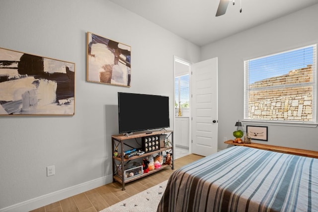 147 Epoch Dr, Austin, TX 78737 - bedroom featuring wood finished floors and a ceiling fan