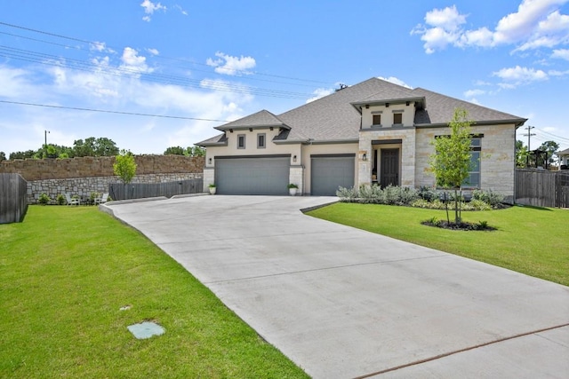 147 Epoch Dr, Austin, TX 78737 - view of front of home featuring stone siding, a garage, driveway, stucco siding, and roof with shingles