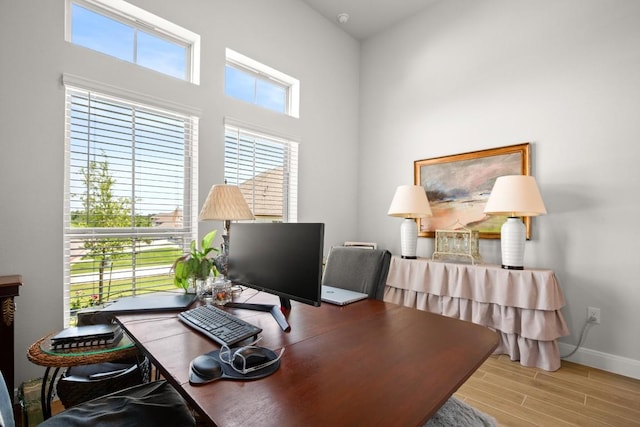 147 Epoch Dr, Austin, TX 78737 - office area with wood finished floors and a high ceiling