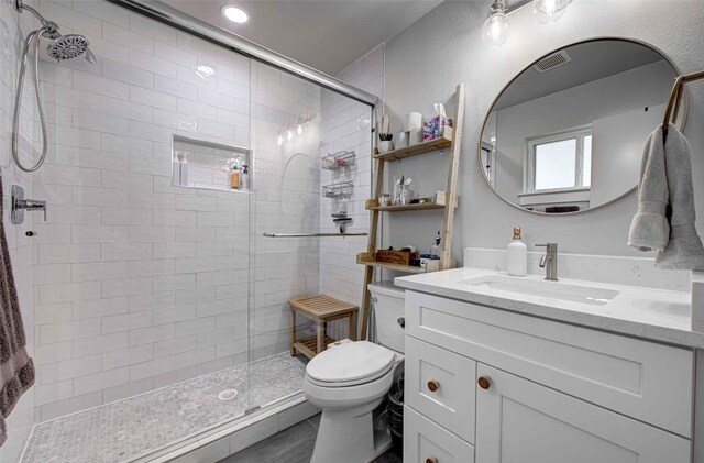 10500 Berthound Dr, Austin, TX 78758 - bathroom with vanity, a shower stall, and recessed lighting