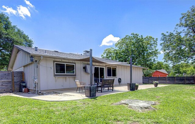 10500 Berthound Dr, Austin, TX 78758 - back of house with board and batten siding, a patio area, and a fenced backyard