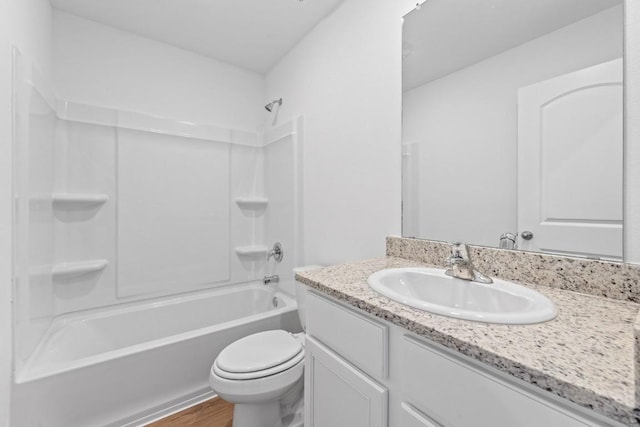 435 Aplite Pass, Maxwell, TX 78656 - full bathroom featuring vanity, wood finished floors, toilet, and tub / shower combination