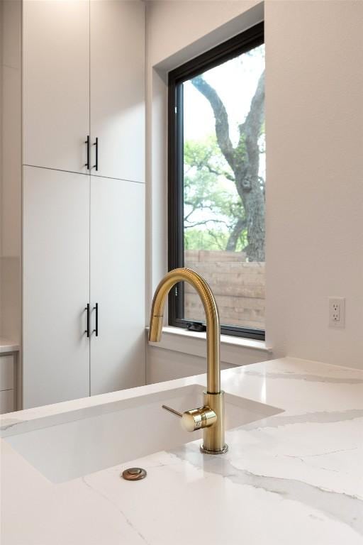 3208 Clawson Rd Unit 2, Austin, TX 78704 - detailed view of light stone counters and white cabinets