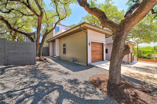 3208 Clawson Rd Unit 2, Austin, TX 78704 - view of side of home with an attached garage and driveway