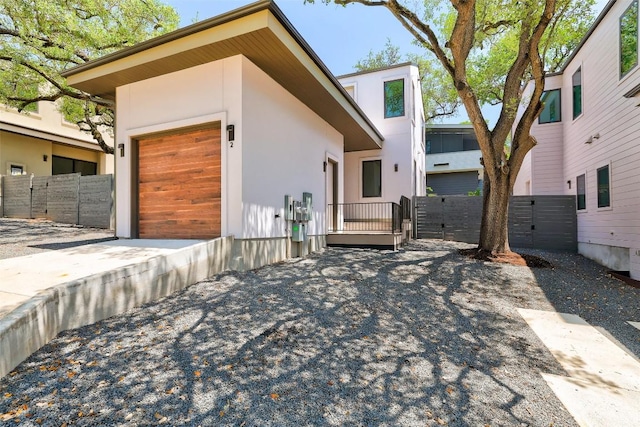 3208 Clawson Rd Unit 2, Austin, TX 78704 - contemporary home with a gate, stucco siding, a garage, and driveway