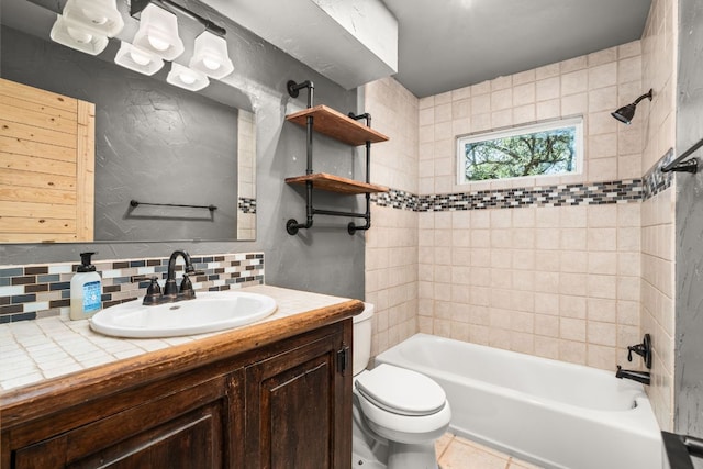 bathroom with tasteful backsplash, shower / washtub combination, toilet, vanity, and tile patterned flooring