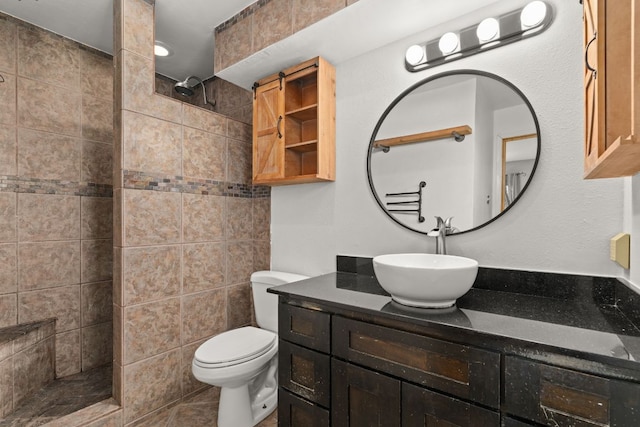 bathroom with a walk in shower, toilet, and vanity