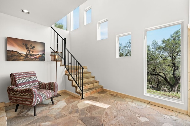 13821 Hunters Pass, Austin, TX 78734 - staircase with stone floors and a high ceiling