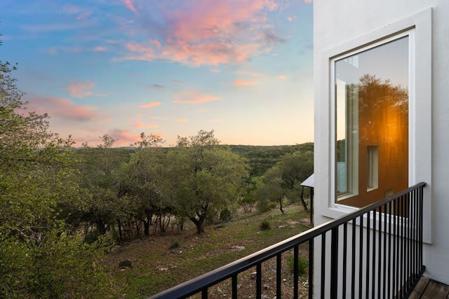 view of balcony at dusk