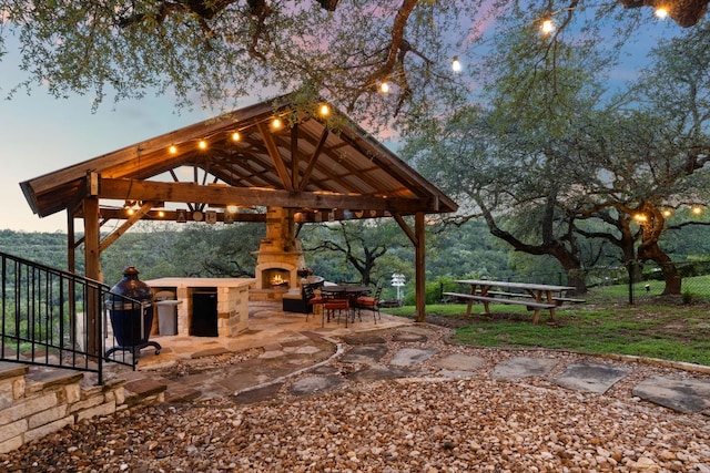 surrounding community featuring a gazebo, a patio area, and fence