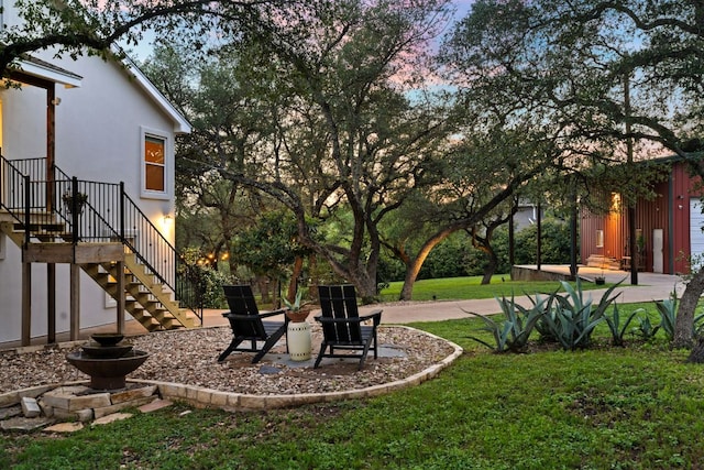 view of green lawn with stairway