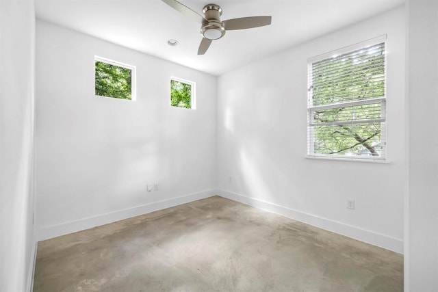 1314 Delano St Unit B, Austin, TX 78721 - spare room featuring baseboards, concrete flooring, and ceiling fan