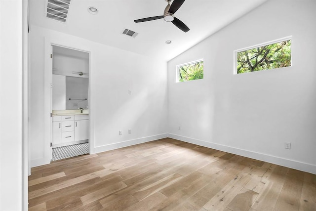 1314 Delano St Unit B, Austin, TX 78721 - unfurnished bedroom featuring light wood finished floors, lofted ceiling, ensuite bathroom, baseboards, and ceiling fan