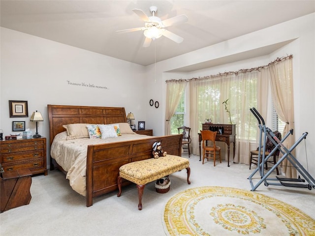 101 Chickadee Cv, Georgetown, TX 78633 - bedroom featuring light carpet and a ceiling fan