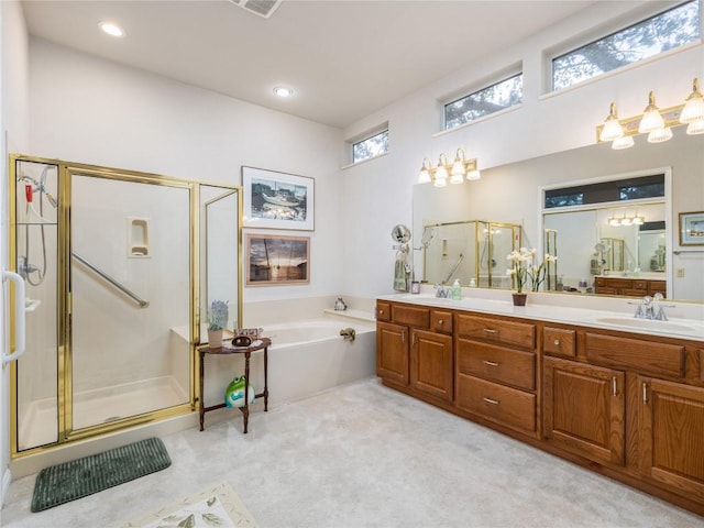 101 Chickadee Cv, Georgetown, TX 78633 - bathroom with a shower stall, double vanity, and a bath
