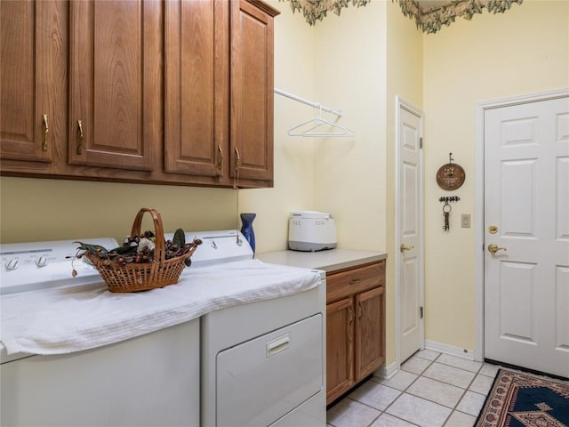 101 Chickadee Cv, Georgetown, TX 78633 - washroom with cabinet space, washer and clothes dryer, light tile patterned flooring, and baseboards