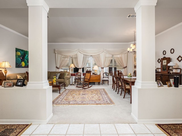 101 Chickadee Cv, Georgetown, TX 78633 - tiled living room featuring ornate columns, carpet floors, ornamental molding, and a chandelier