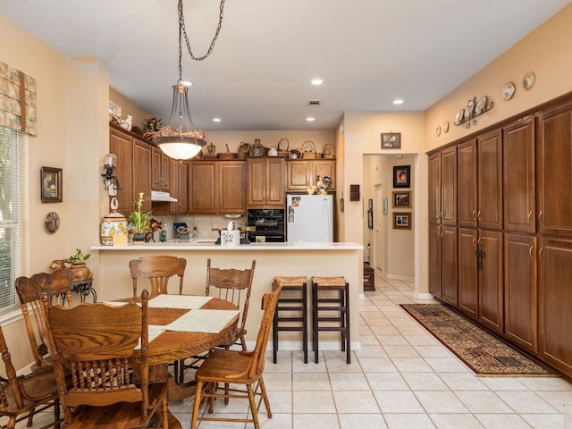 101 Chickadee Cv, Georgetown, TX 78633 - dining space featuring light tile patterned floors and recessed lighting