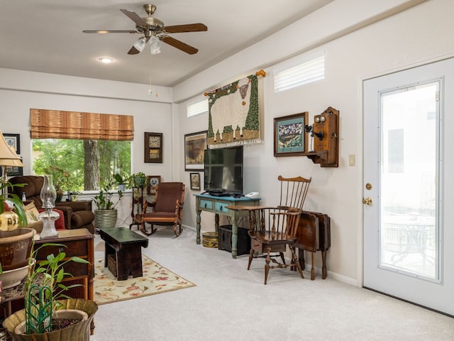 101 Chickadee Cv, Georgetown, TX 78633 - carpeted living area featuring a ceiling fan and baseboards