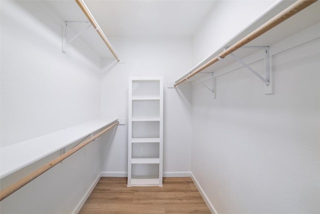 walk in closet featuring light wood-type flooring