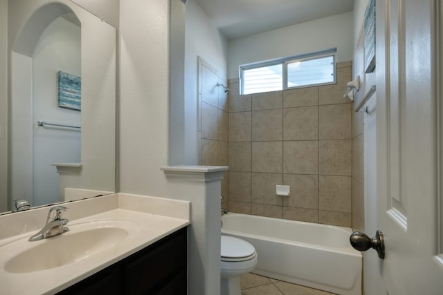 full bath featuring tile patterned flooring, toilet, vanity, and shower / bath combination