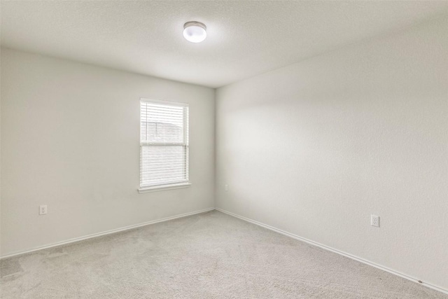 11905 Reindeer Dr, Austin, TX 78754 - unfurnished room featuring light colored carpet and baseboards