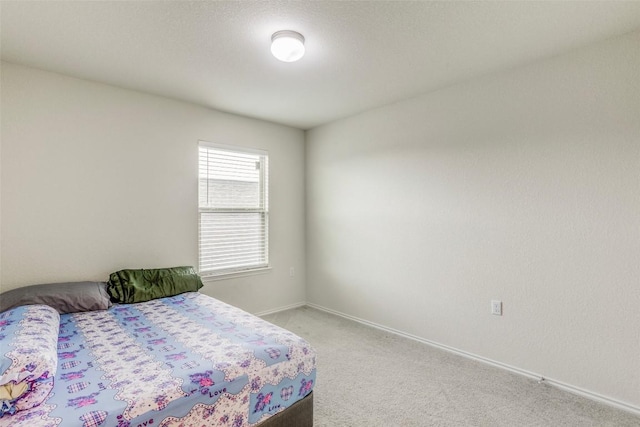 11905 Reindeer Dr, Austin, TX 78754 - bedroom featuring light colored carpet and baseboards