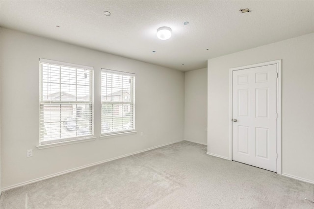 11905 Reindeer Dr, Austin, TX 78754 - empty room with light colored carpet and baseboards