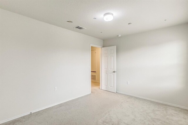 11905 Reindeer Dr, Austin, TX 78754 - unfurnished room featuring light colored carpet and baseboards