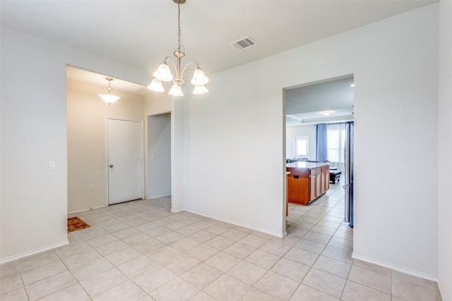 11905 Reindeer Dr, Austin, TX 78754 - unfurnished room featuring a chandelier, baseboards, and light tile patterned floors